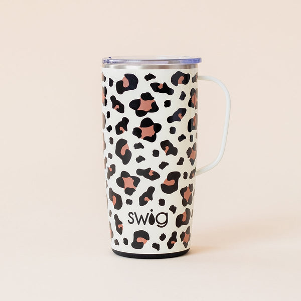 Swig Life 22oz Luxy Leopard Travel Mug with Handle on beige background