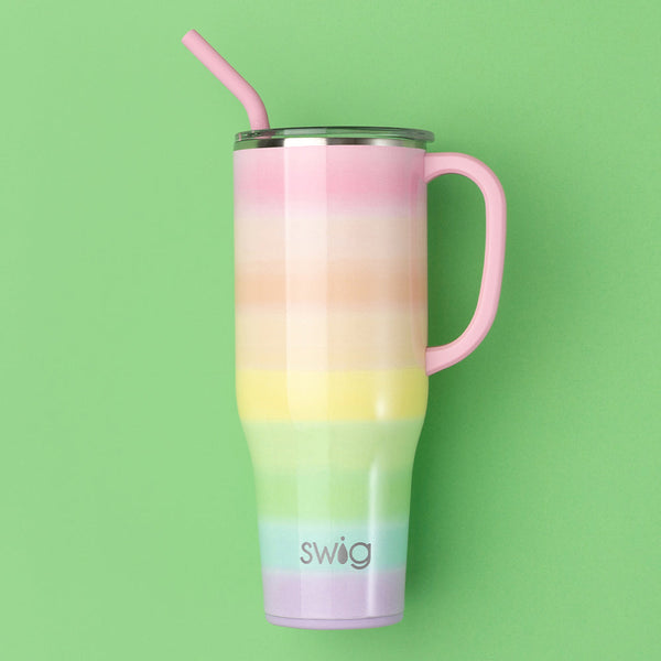 https://www.swiglife.com/cdn/shop/products/swig-life-signature-40oz-insulated-stainless-steel-mega-mug-with-handle-over-the-rainbow-lifestyle_grande.jpg?v=1689792120